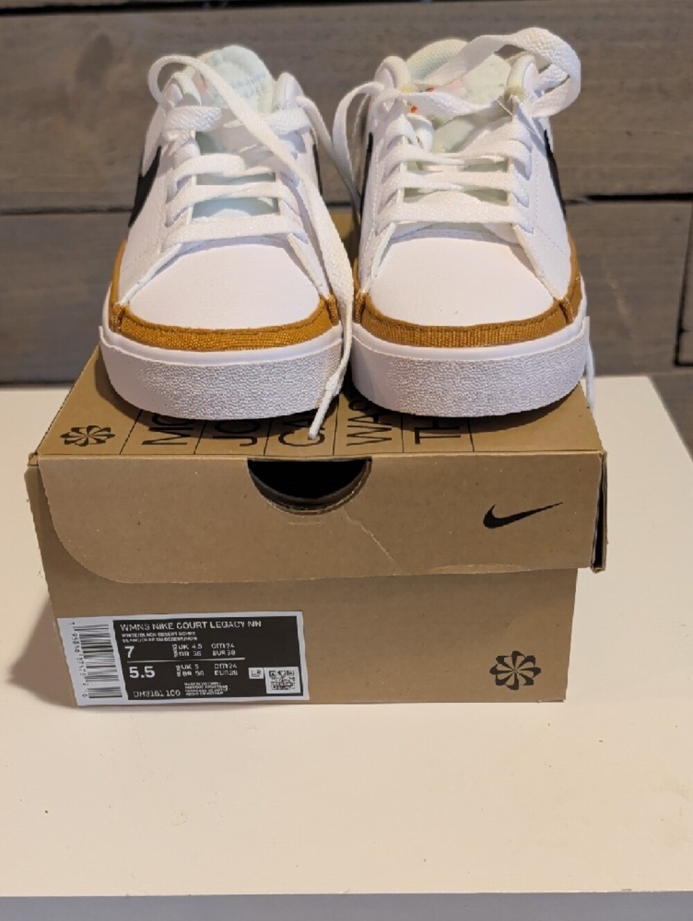 Nike White Sneakers with Black Swoosh and Brown Accent - Picture 2 of 4